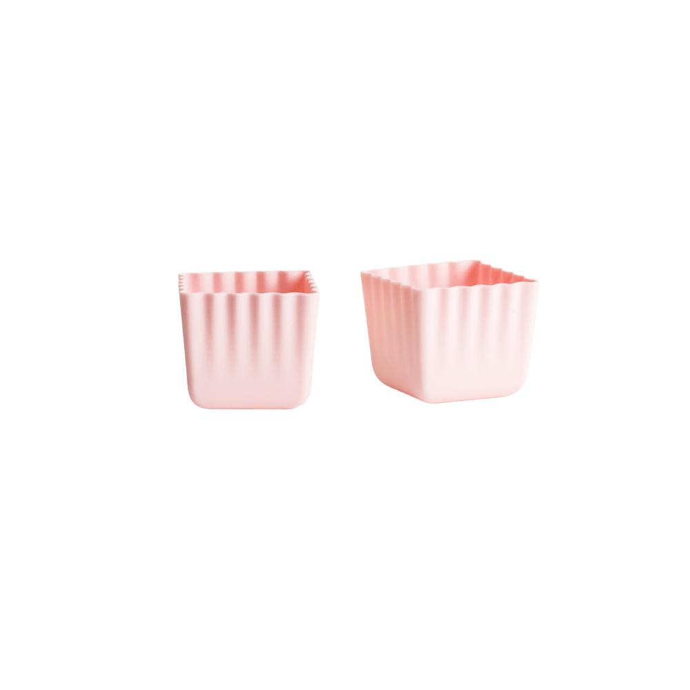 A clearcut image of 2 x Nestling Silicone Bento Cups in the colour Dusty Pink.