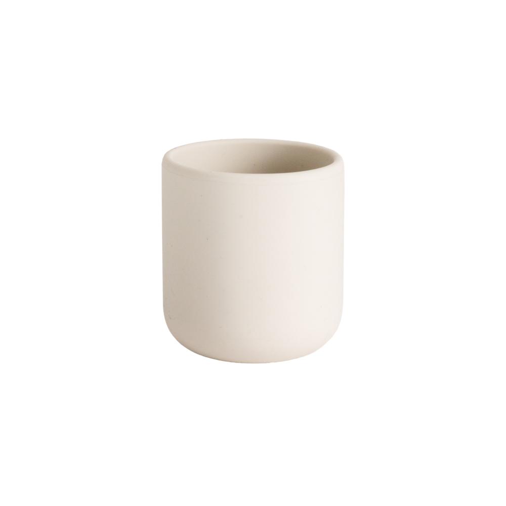 A clearcut image of the Nestling Silicone Training Open Baby Cup in the colour Oat.