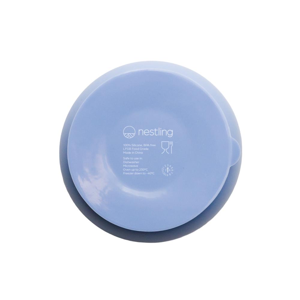 A clearcut image of the Nestling Stainless Steel Suction Bowl in the colour Dusty Blue. This is showing the back/underside of the plate showcasing the suction feature.