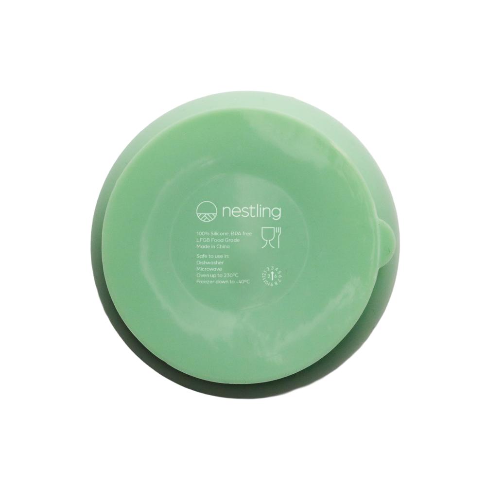 A clearcut image of the Nestling Stainless Steel Suction Bowl in the colour Sage. This is showing the back/underside of the plate showcasing the suction feature.