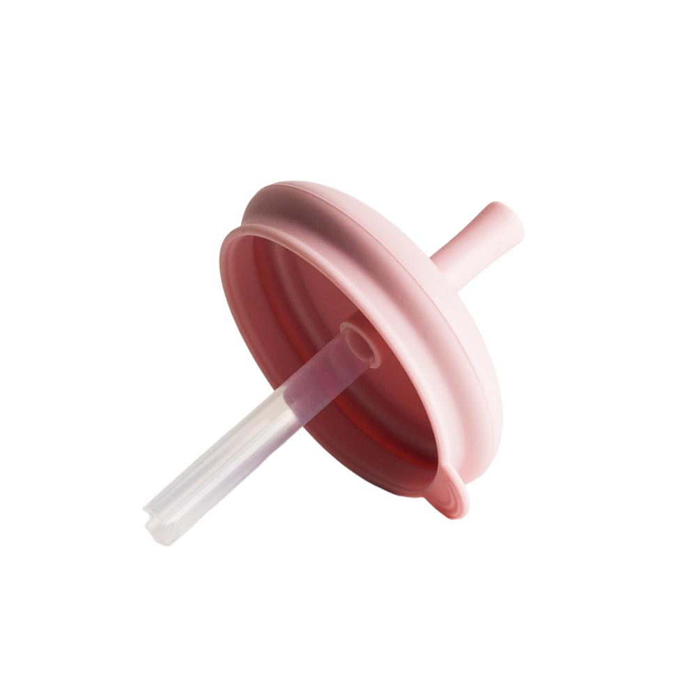A clearcut image of the Nestling Silicone Replacement Straw with the lid in the colour Dusty Pink.