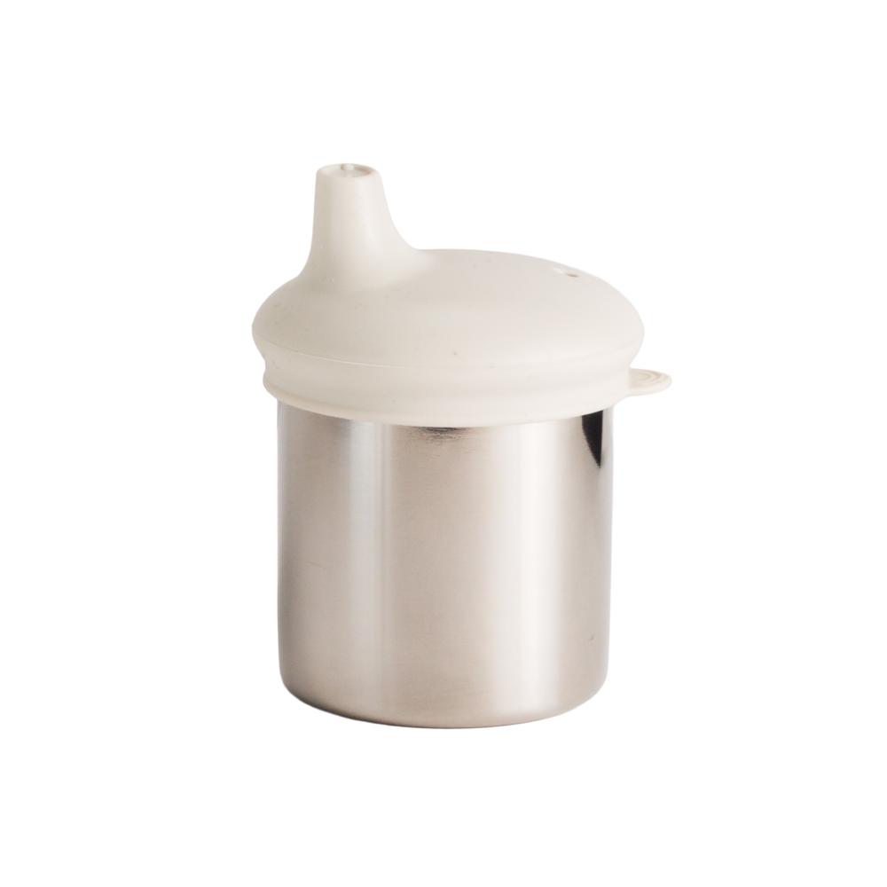 The Nestling Stainless Insulated Sip & Straw Cup in the Oat colour. The cup has the sipper lid attached.