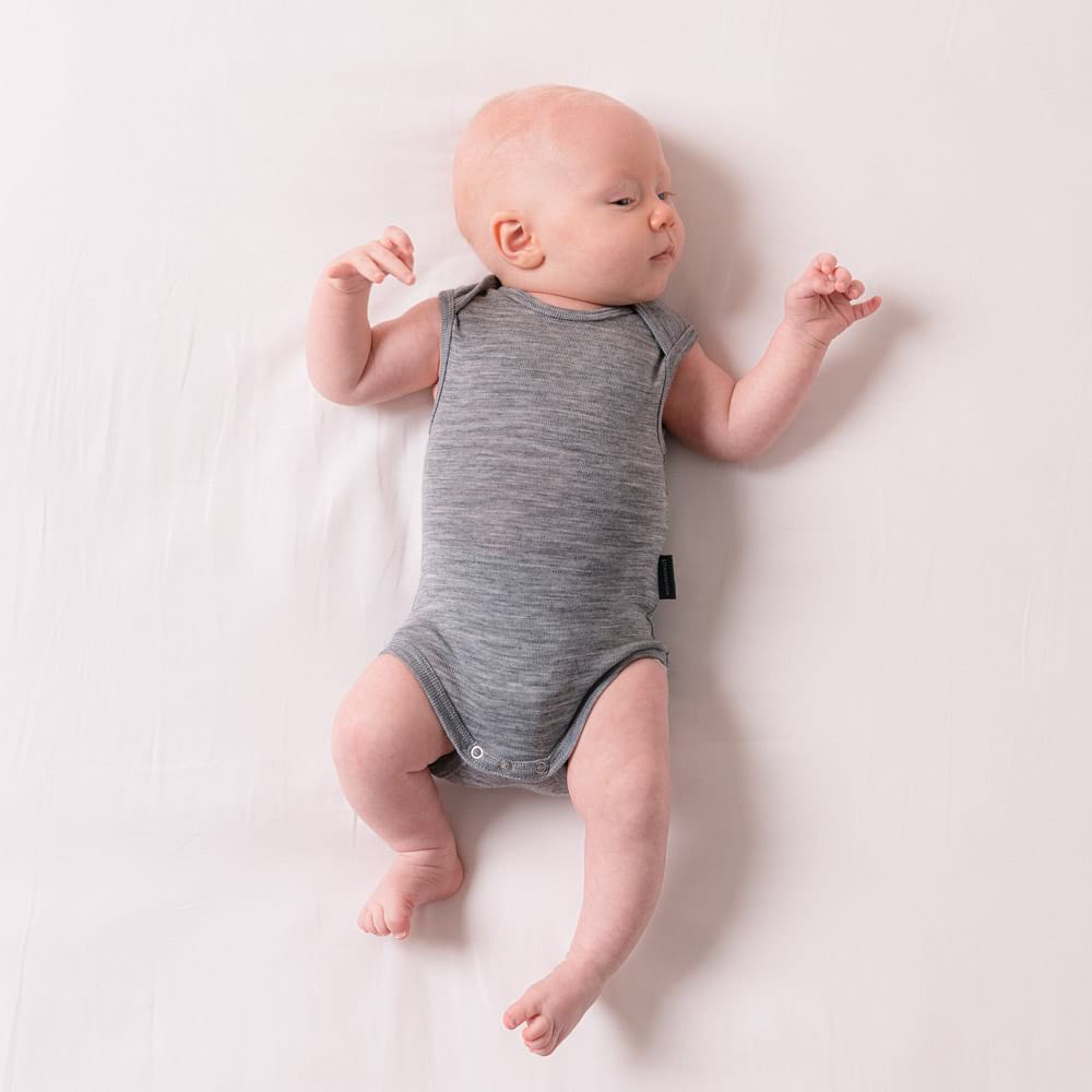 newborn baby wearing a grey The Sleep Store Deluxe Merino Rib Singletsuit