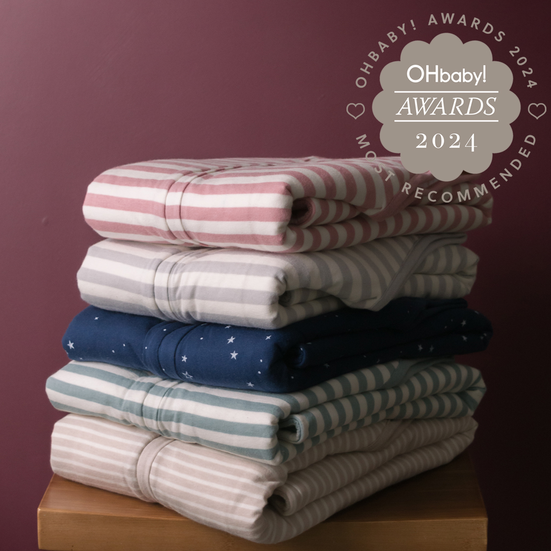 stack of woolbabe sleeping bags folded on a table