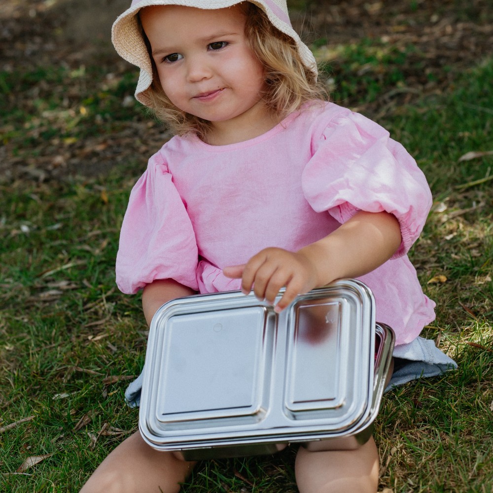 Preschool child holding nestling duo stainless steel lunchbox