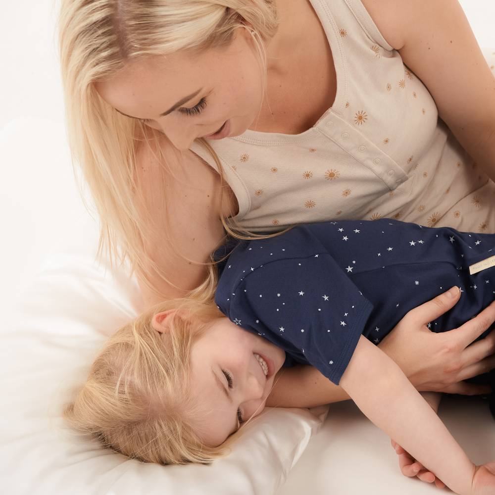 Mum and daughter with 100% mulberry silk pillowcase on pillow