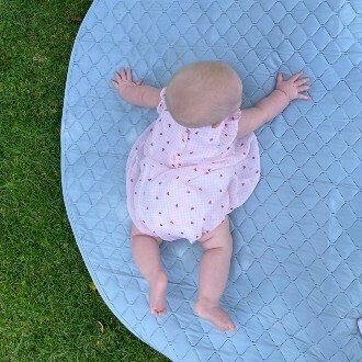 baby-lying-on-nestling-waterproof-playmat-outside-square.jpg