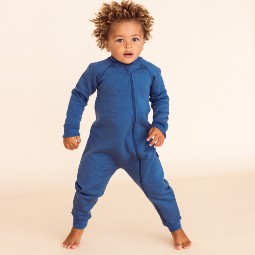 boy-jumping-wearing-a-the-sleep-store-merino-fleece-onesie-denim.jpg