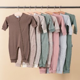 the-sleep-store-jersey-merino-onesies-hanging-on-a-rack.jpg