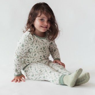 toddler-girl-sitting-up-wearing-woolbabe-merino-organic-cotton-pyjama-s-in-sage-bugs-small.jpg