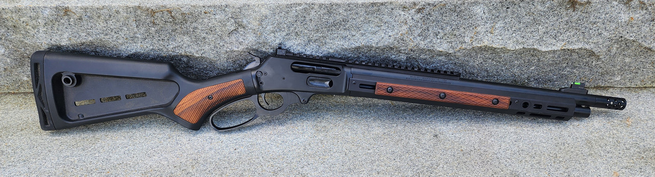 Marlin Dark Series rifle with wood grip inserts in stock and wood M-LOK rail covers
