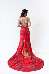 Red halter gown featuring a keyhole neckline and over 100+ gold and red embroidered florals. Available to hire or purchase at Bridal Fusion by Steph. Perfect for modern tea ceremonies or evening receptions. Under $2,000.