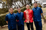 Asian groom and 3 groomsmen wearing matching blue dragon Chinese outfits for tea ceremony - Bridal Fusion by Steph