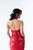 Back shot - Halter neck red cheongsam gown featuring elegant floral embroidery and asymmetrical neckline. Perfect for tea ceremonies or modern cultural weddings. Available to purchase or hire at Bridal Fusion by Steph in Auckland. Under $2,000, with over 10+ styles to try on.