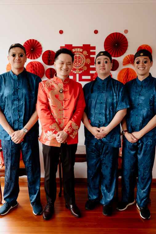 Asian groom and 3 groomsmen wearing matching blue dragon Chinese outfits for tea ceremony - Bridal Fusion by Steph