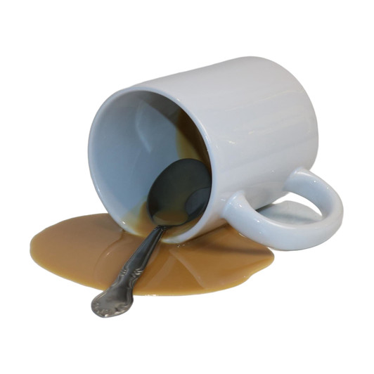 Fake Spilled Coffee with Cream and Spoon in  White Ceramic Mug