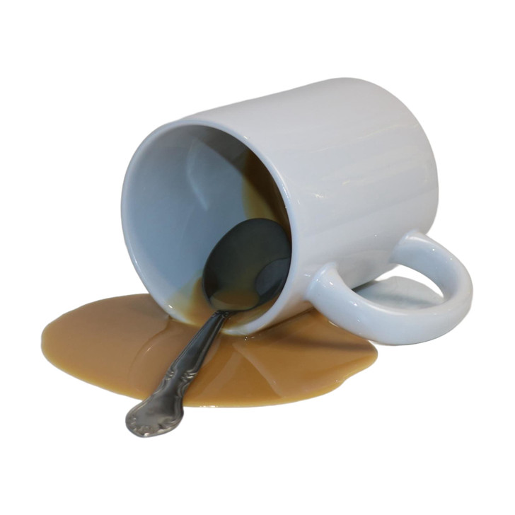 Fake Spilled Coffee with Cream and Spoon in  White Ceramic Mug