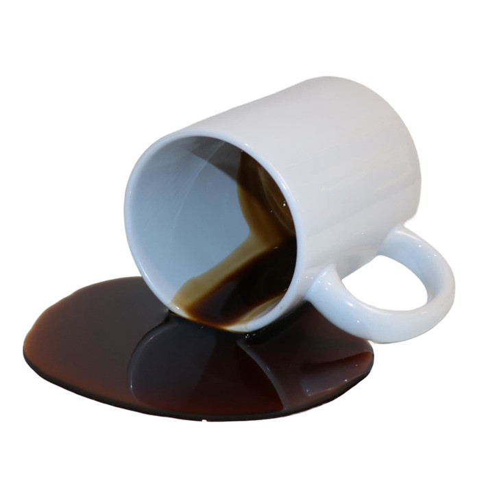 Fake Spilled Black Coffee in a White Ceramic Mug