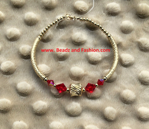 14k gold July tunnel medium bangle