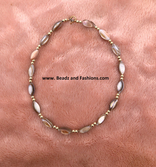 14k gold brown swirl bracelet.