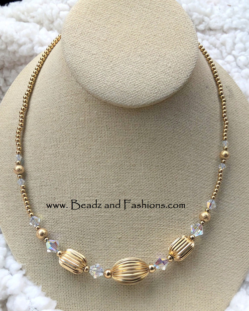 14k gold Clear Tube Rice necklace