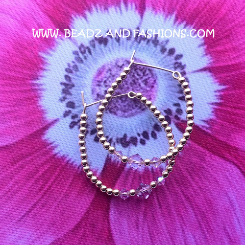 14k gold June large hoop earrings.