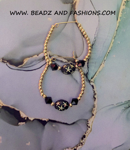 14k gold Large black stardust oval hoop earring.