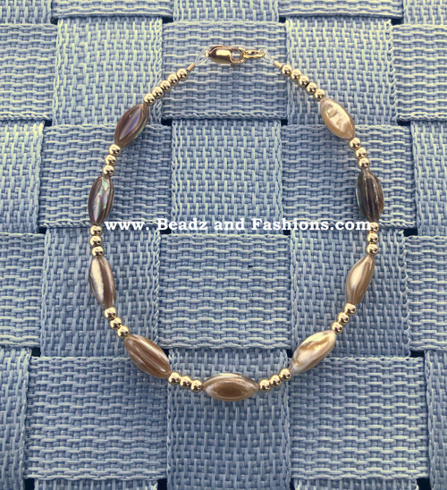 14k gold  brown swirl bracelet