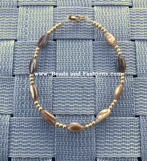14k gold brown swirl bracelet