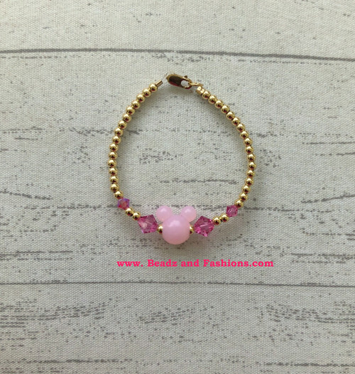 14k gold  pink mickey bracelet.