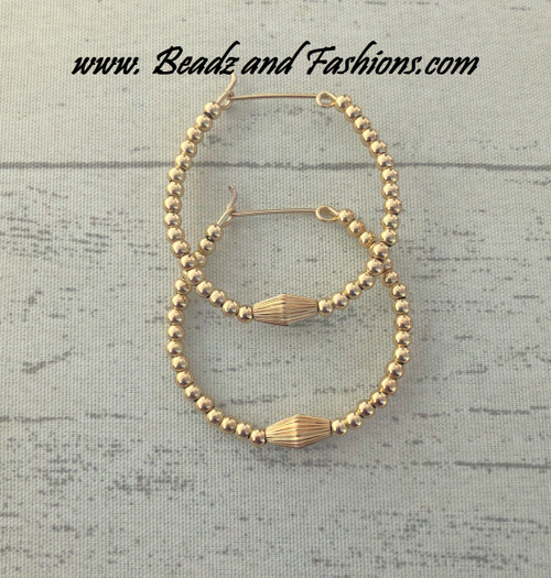 14k All gold Large torpedo hoop earrings