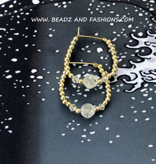 14k gold Clear Medium stardust hoop earring.