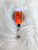 Orange Pill bottle planar badge reel