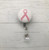 Pink and white breast cancer badge reel