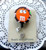 M&M orange badge reel