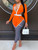 Orange one piece jumpsuit