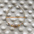 14k gold November oval stardust bracelet .