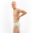 Male model wearing training pants, side-view.