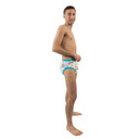 Male model wearing adult training pants, side-view.