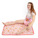 Female model sitting on the absorbent Purrfection change pad.