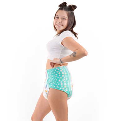 Female model wearing adult Alpaca diaper, side-view.