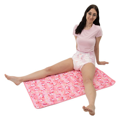 Female model sitting on Lil Bella change pad.