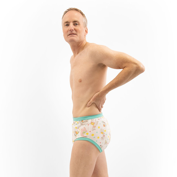 Male model wearing training pants, side-view.