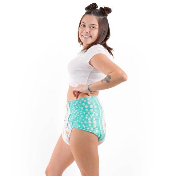 Female model wearing adult Alpaca diaper, side-view.
