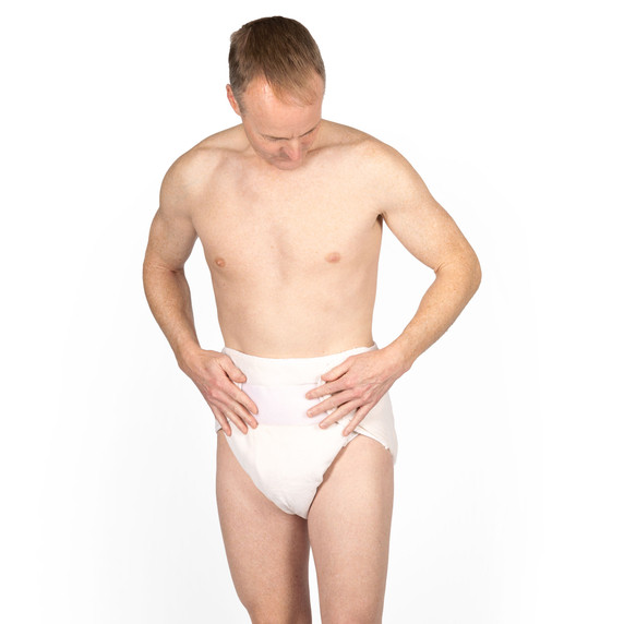 Male wearing Omutsu Waddle Cloth Diaper, with hands placed on the tabs.