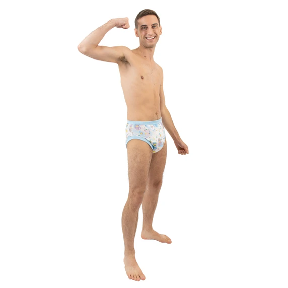 Male model wearing adult training pants, side-view.