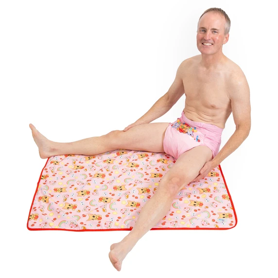 Male model sitting on waterproof Purrfection change pad.