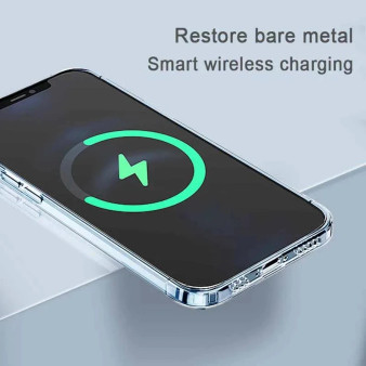 Samsung phone with clear case wirelessly charging on a light grey surface with green charging icon.
