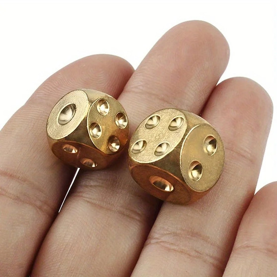OFS Brass Copper Dice Set, 15mm, two shiny gold dice in a hand.