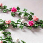 Dollhouse Miniature Garden Scene with pink, white, and green flower vines and realistic small flowers.